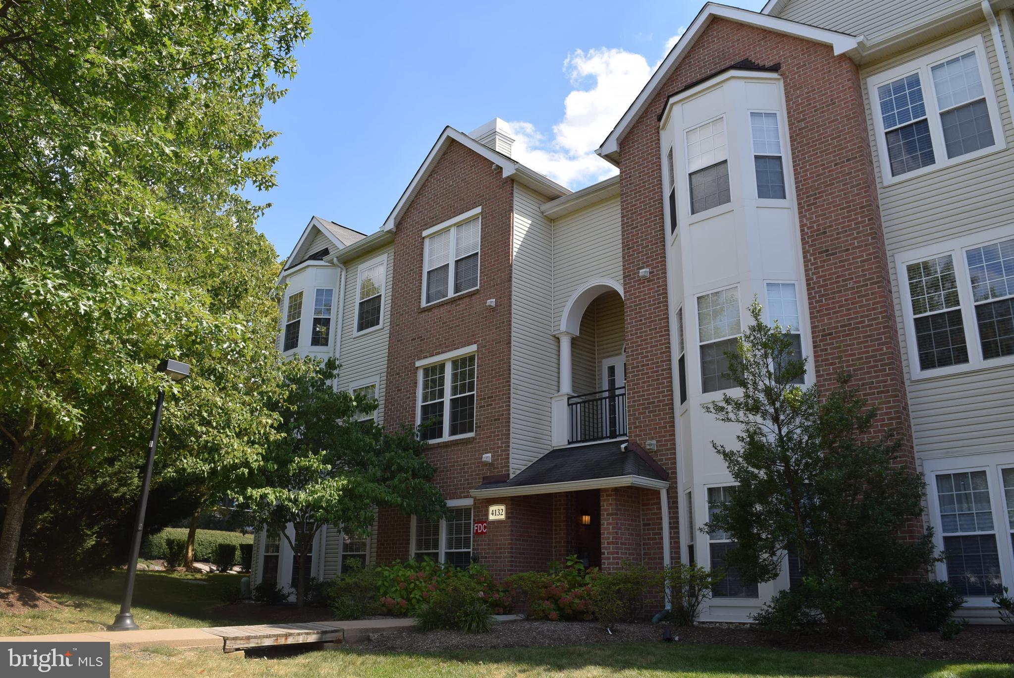 a front view of residential houses with yard