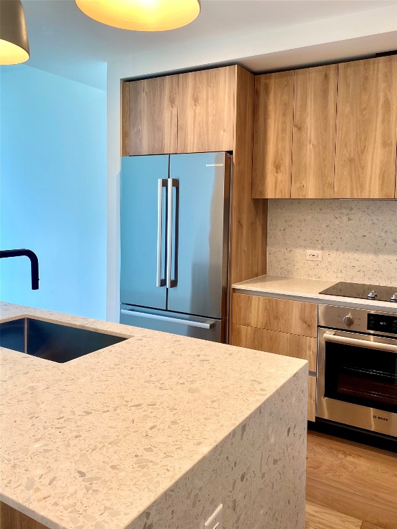 a kitchen with a refrigerator and a sink