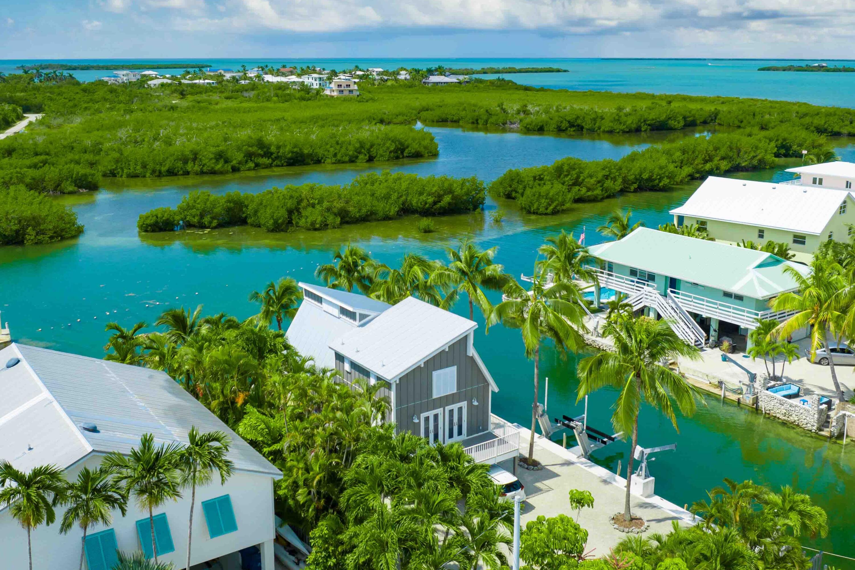 an aerial view of residential house with outdoor space and lake view