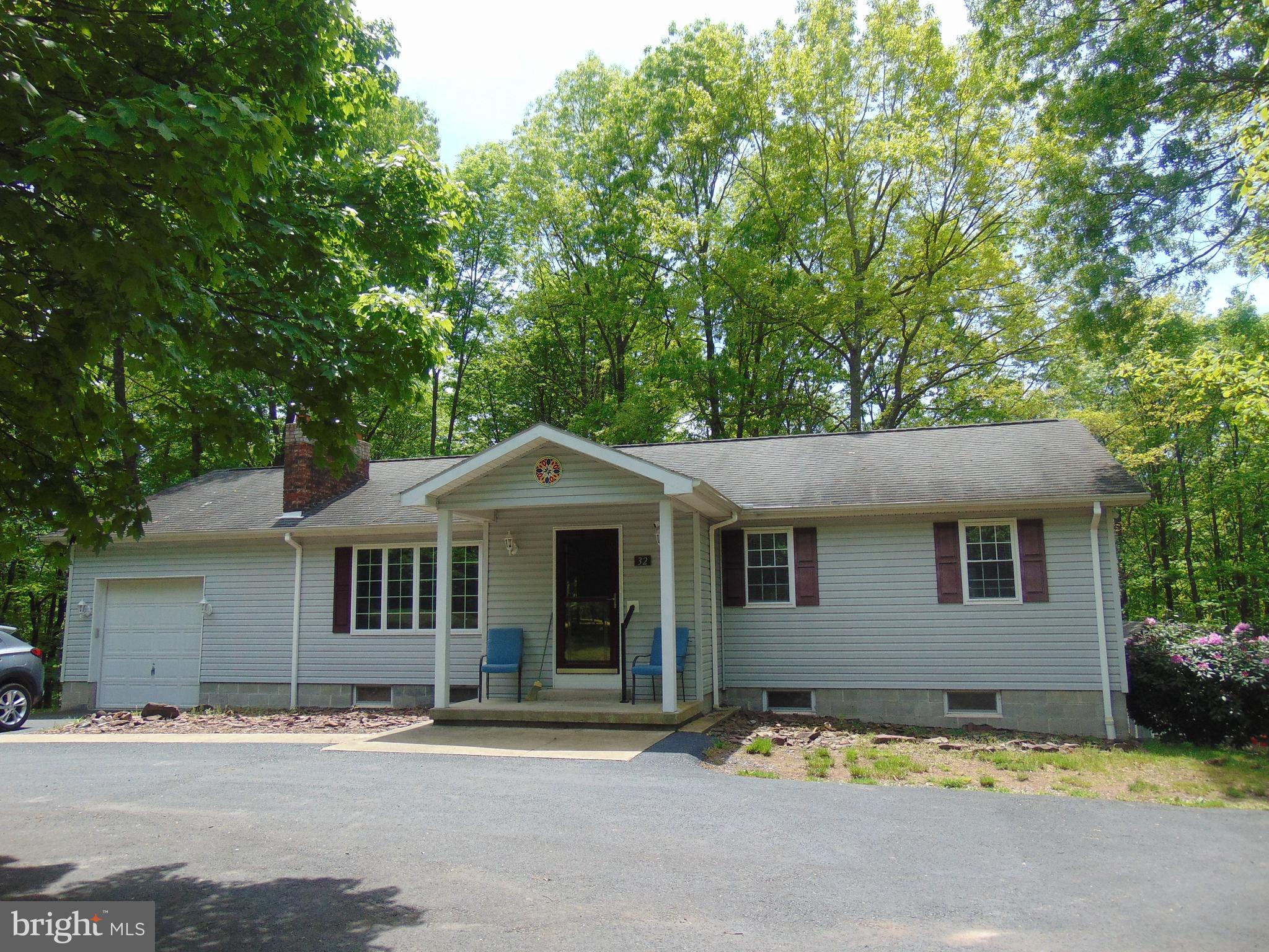 a front view of a house with yard