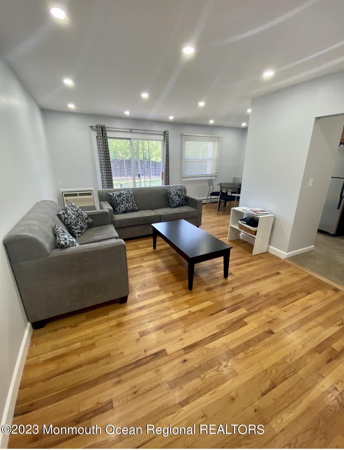 a living room with furniture and a table