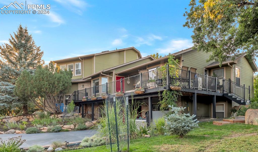 Rear view of house featuring a deck