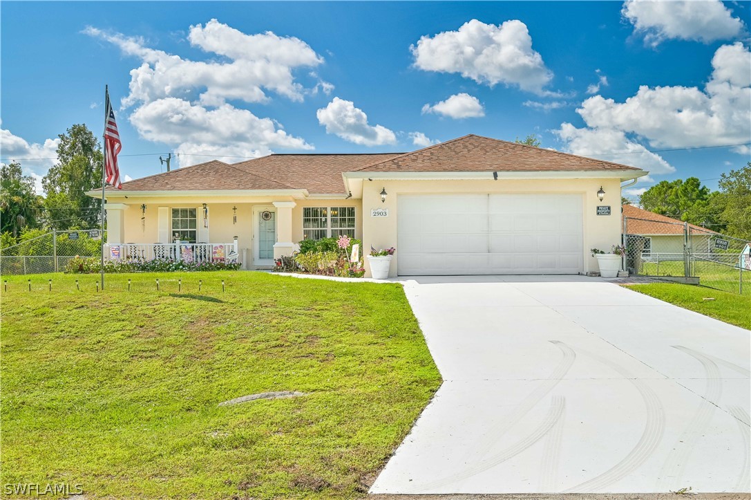 a view of house with yard