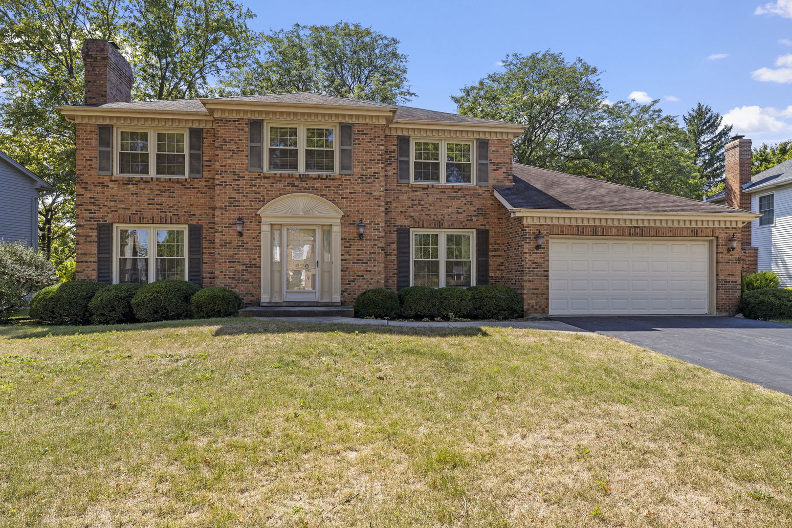 a front view of a house with yard