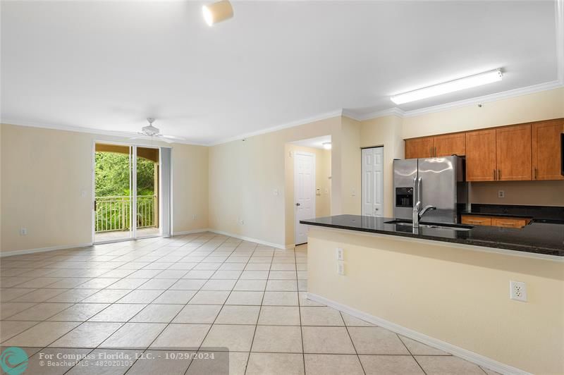 a view of a kitchen with a sink and a window