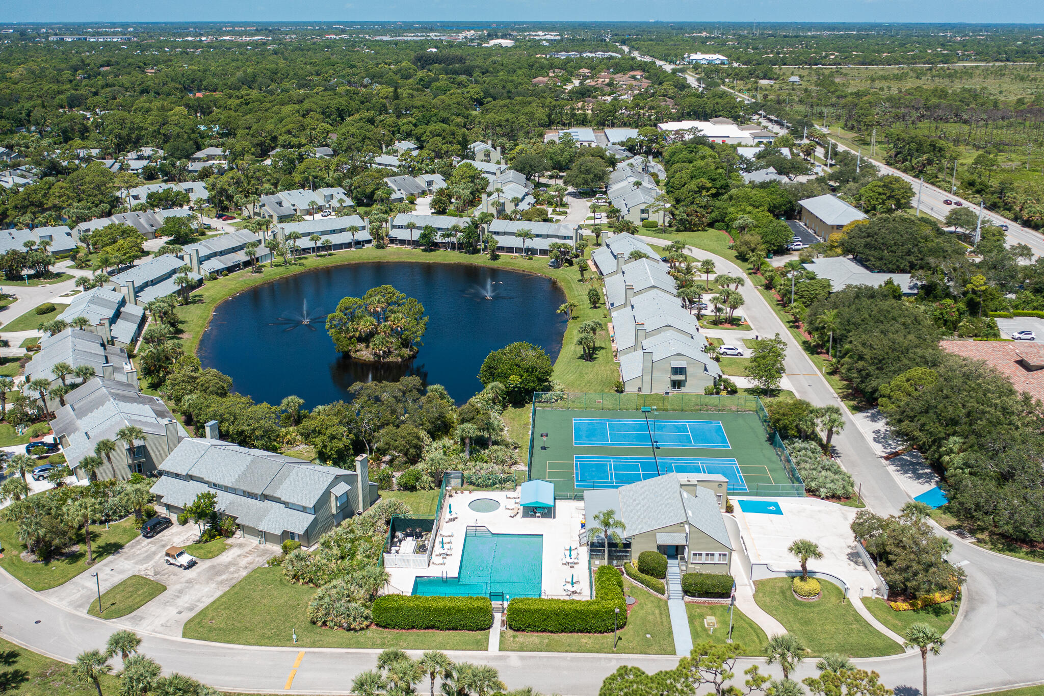 an aerial view of residential houses with outdoor space