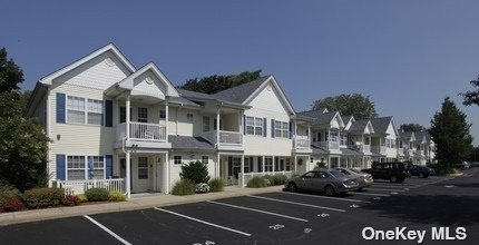 a view of multiple houses with a street