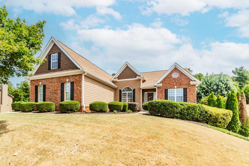 a front view of a house with a yard