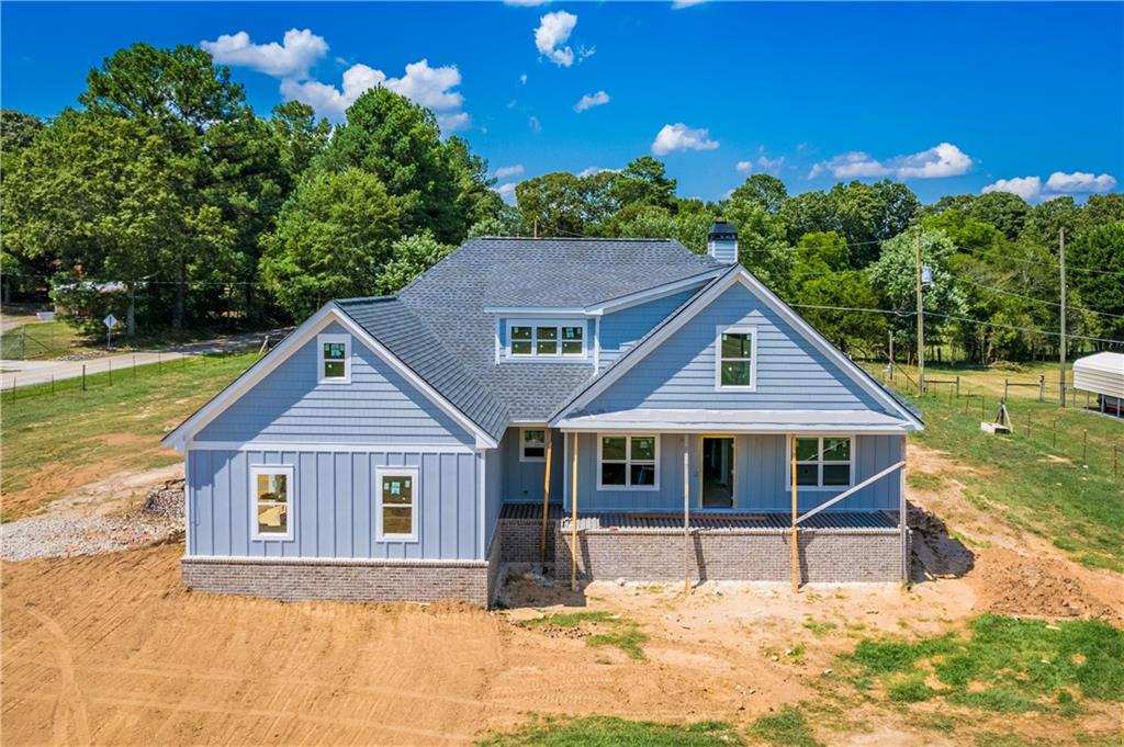 a house with trees in the background