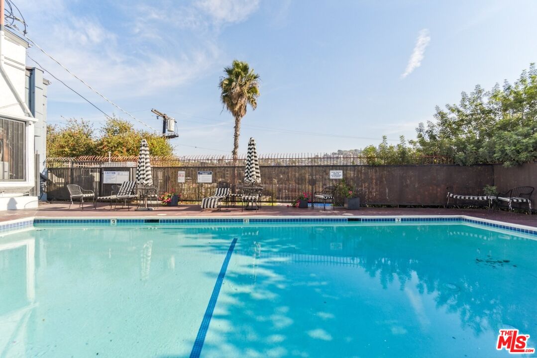 a view of swimming pool outdoor seating and garden