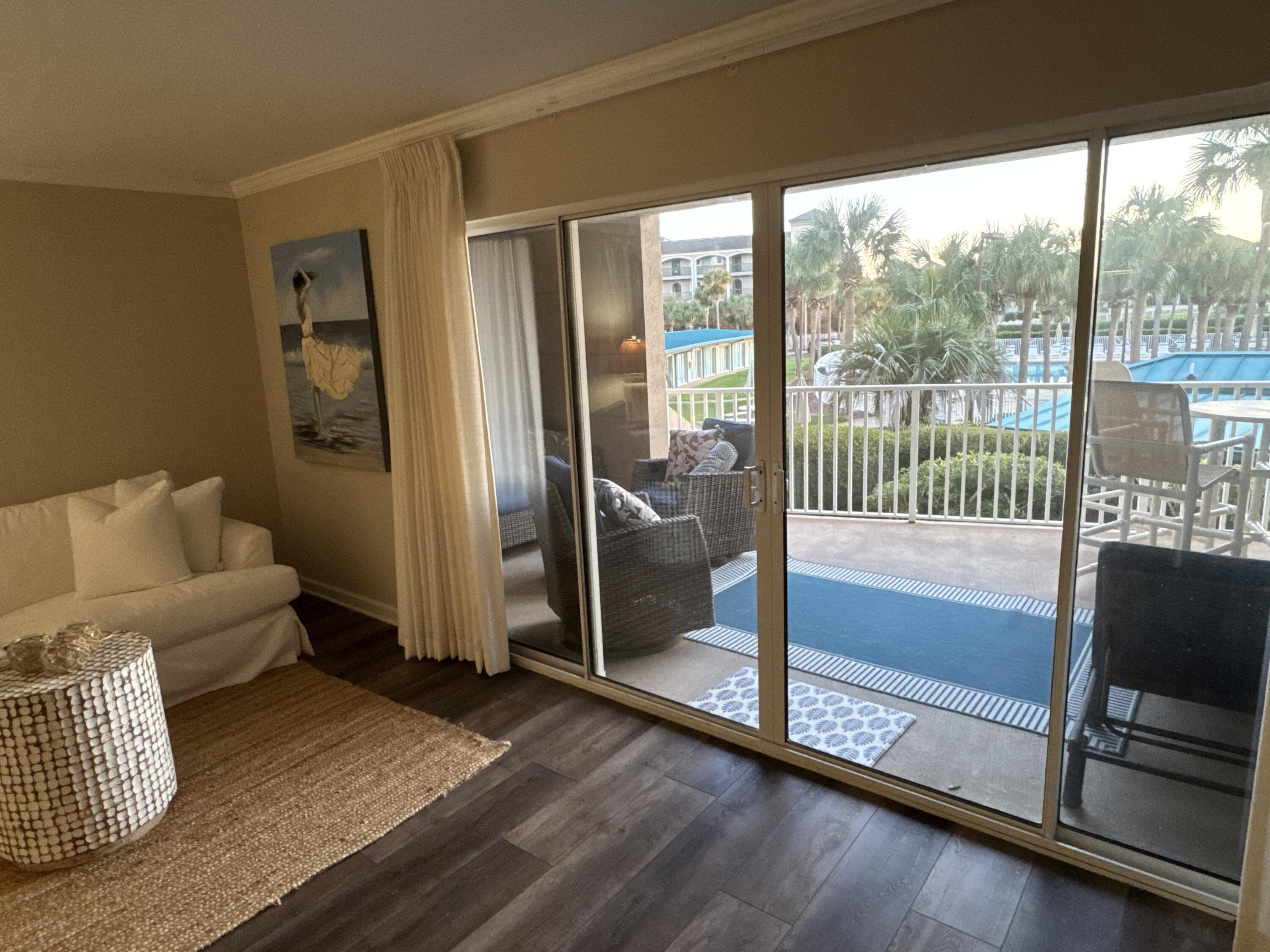 a view of livingroom with furniture and floor to ceiling window