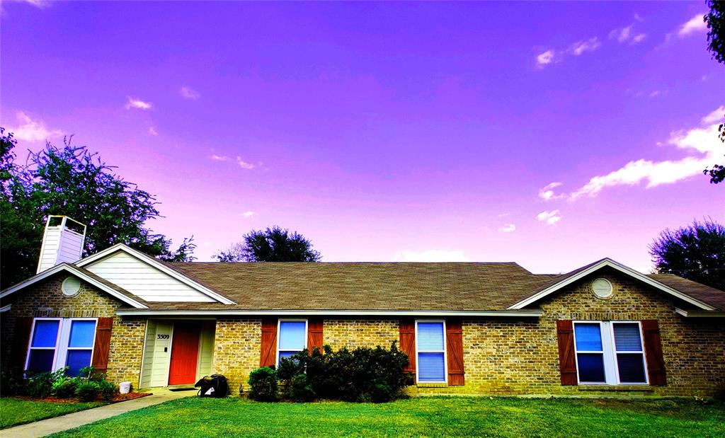 a front view of a house with yard