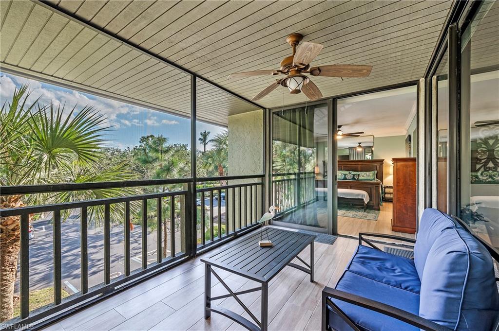 a view of a balcony with furniture