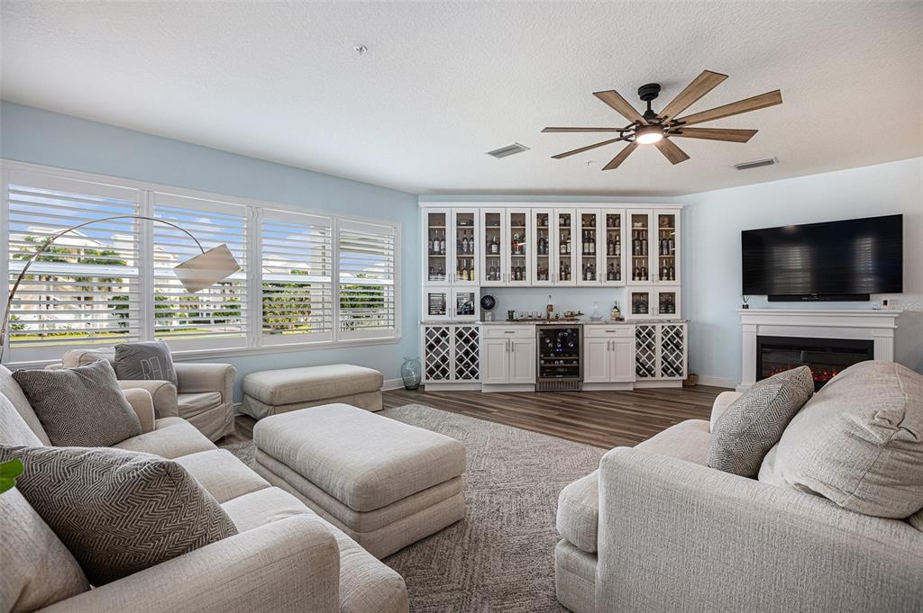 a living room with fireplace furniture and a flat screen tv