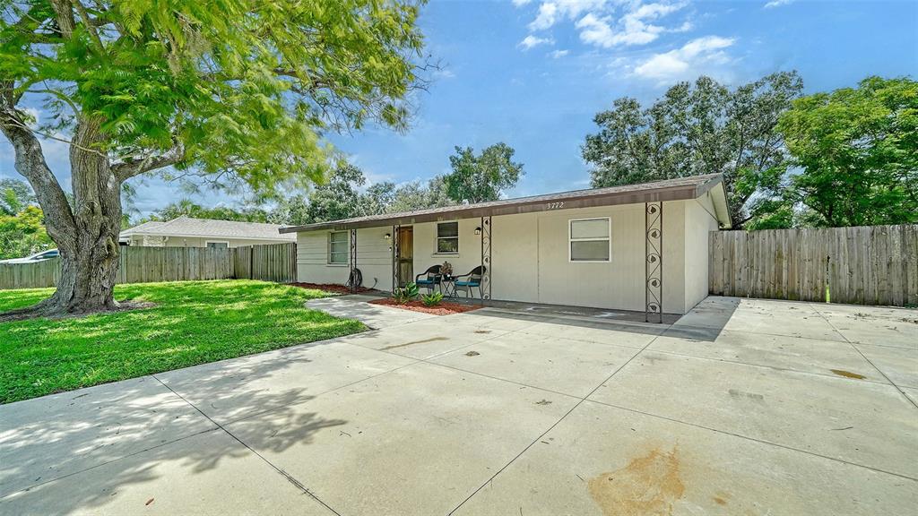 a view of a house with a yard and garage