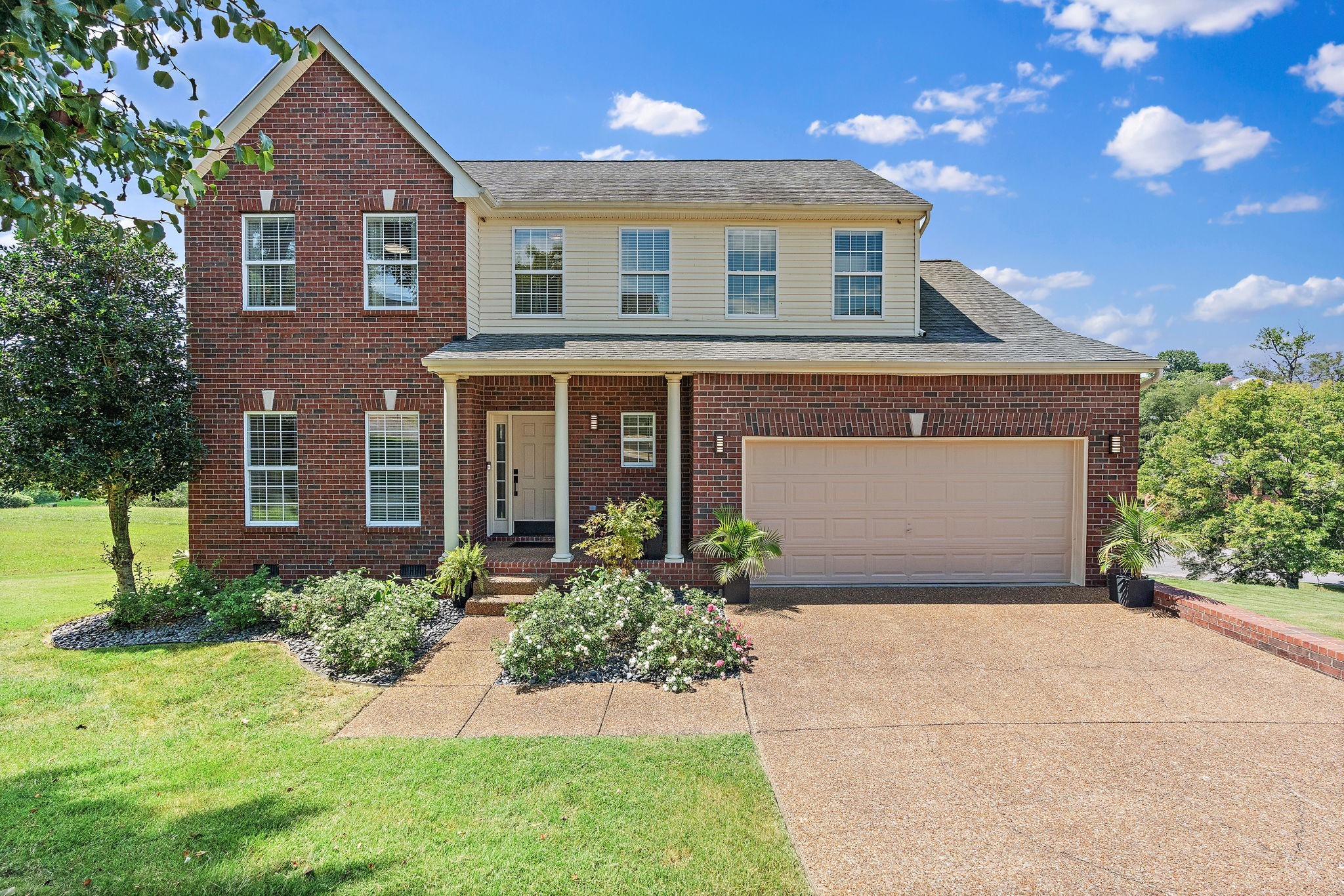 front view of a house with a yard