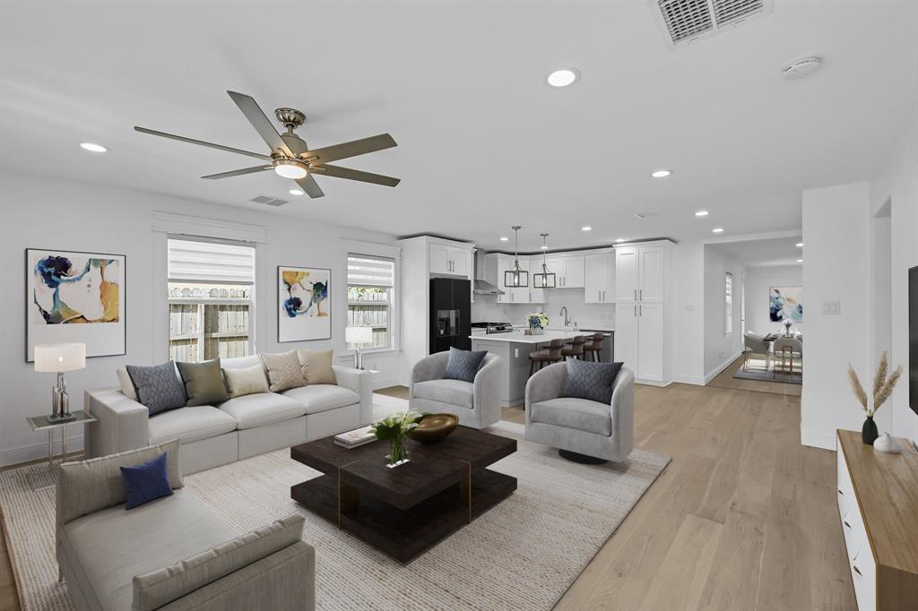 Engineered wood flooring throughout this space. (Virtually Staged)