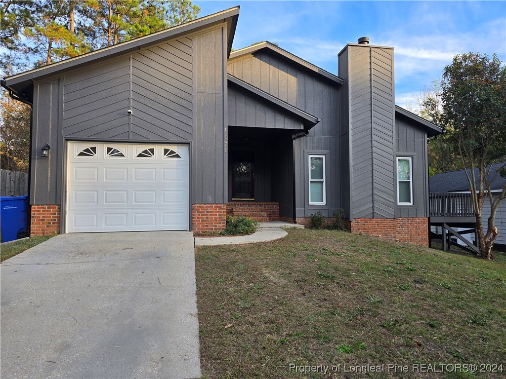 a front view of a house with garage