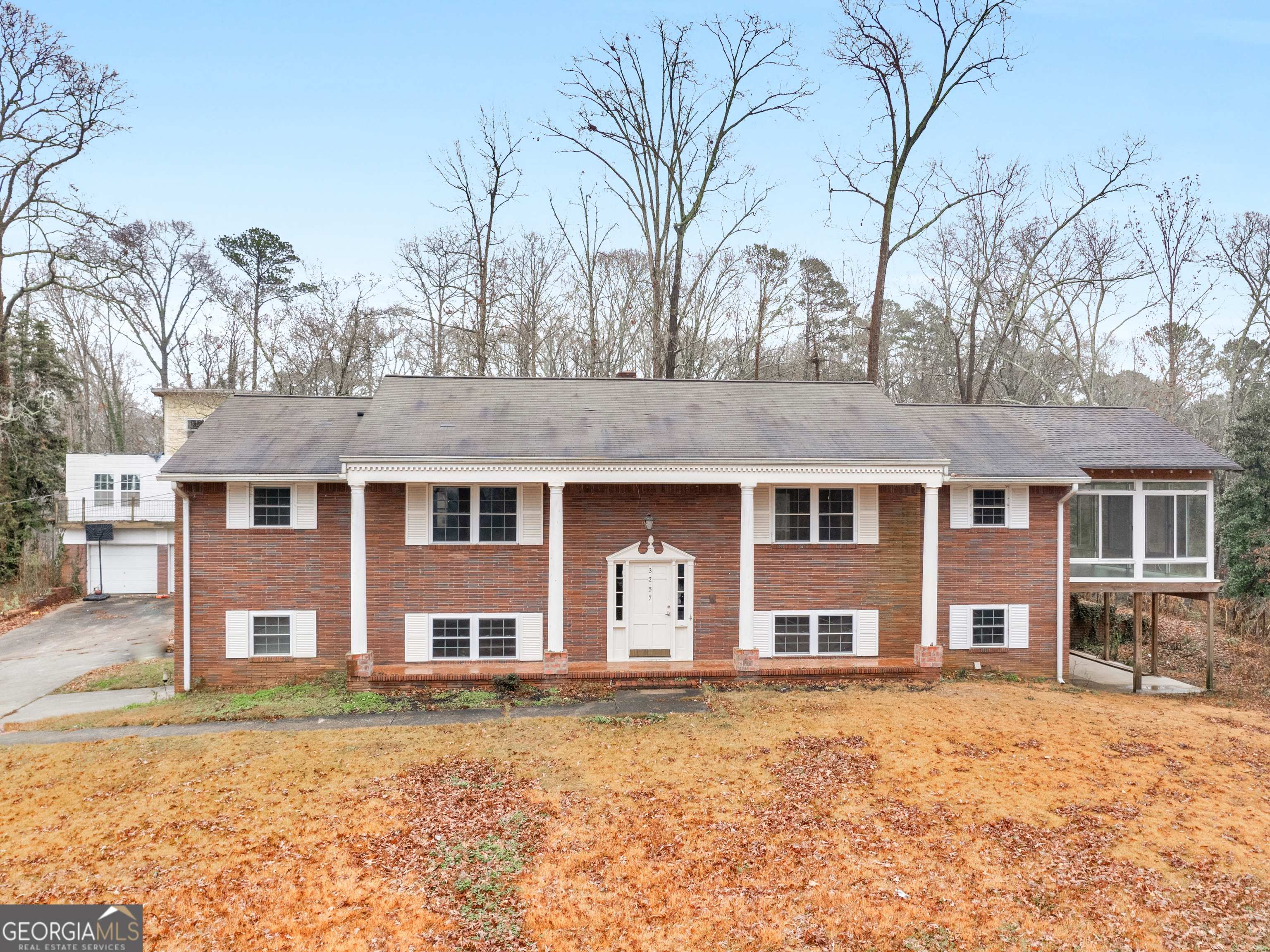 front view of a house with a yard