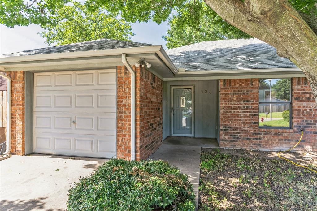 an entrance to house with yard