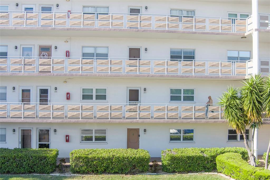 a front view of a building with a lot of windows