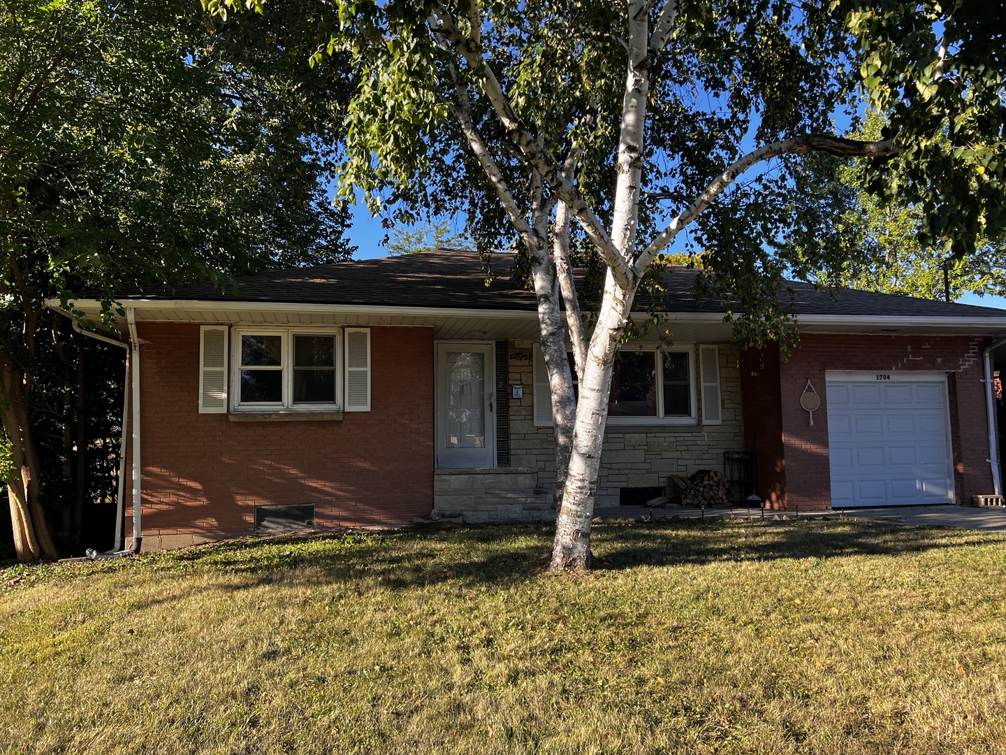 a view of house with tree in front of it