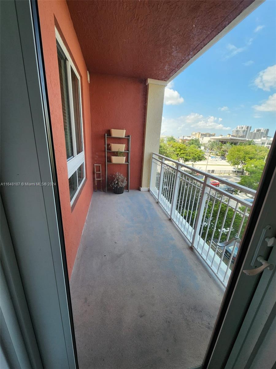 a view of balcony with furniture