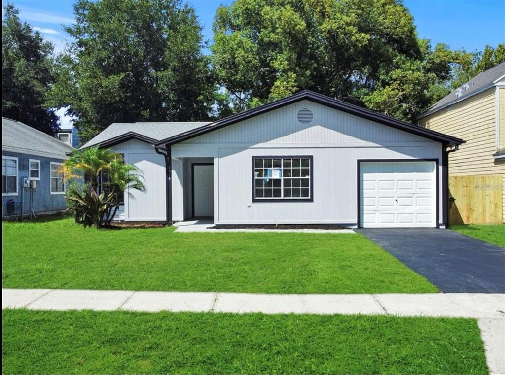 a view of a house with a yard