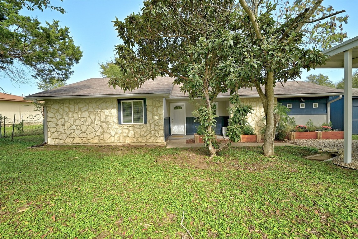 a front view of a house with a garden and porch