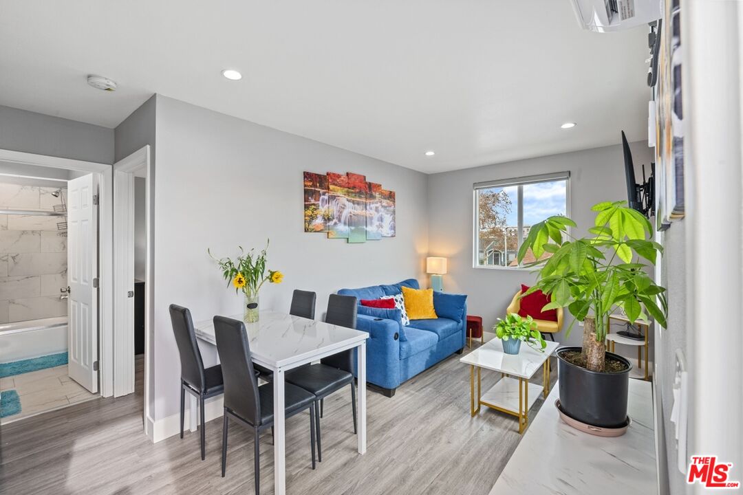 a workspace with furniture and a potted plant