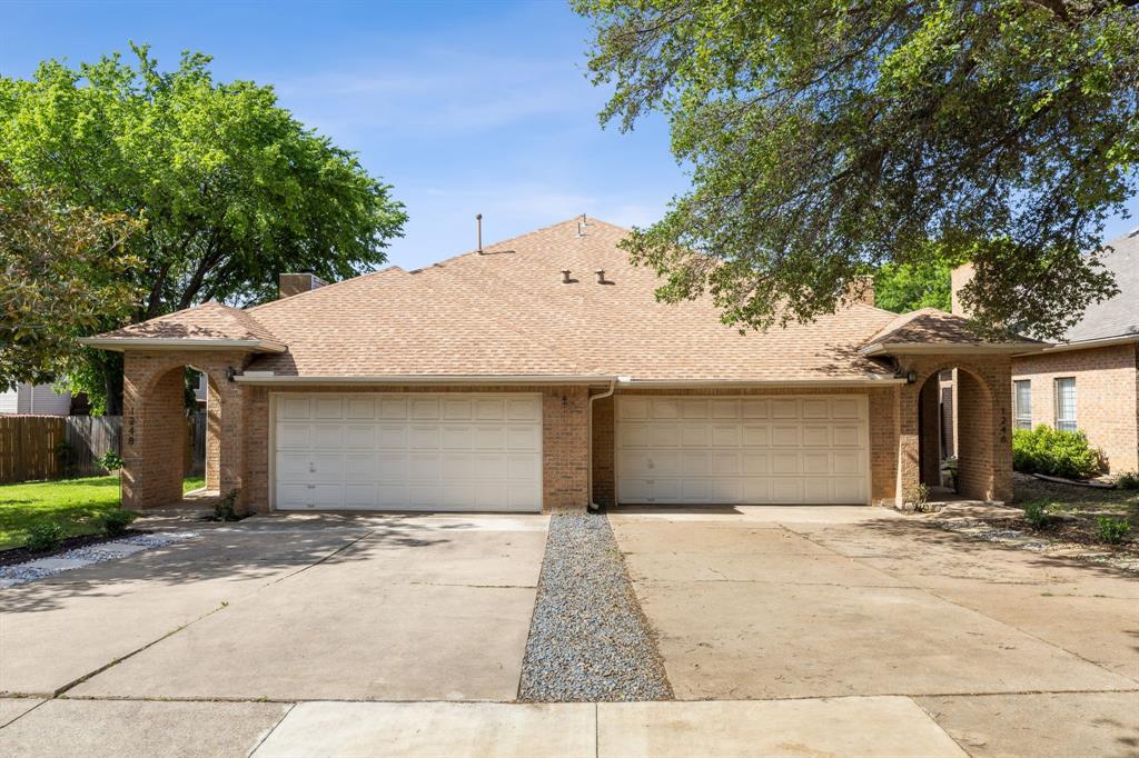 a front view of a house with a garage