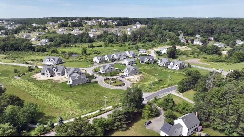 an aerial view of a golf course with outdoor space