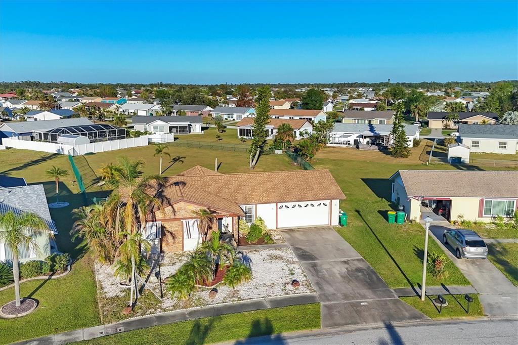 an aerial view of residential houses with outdoor space