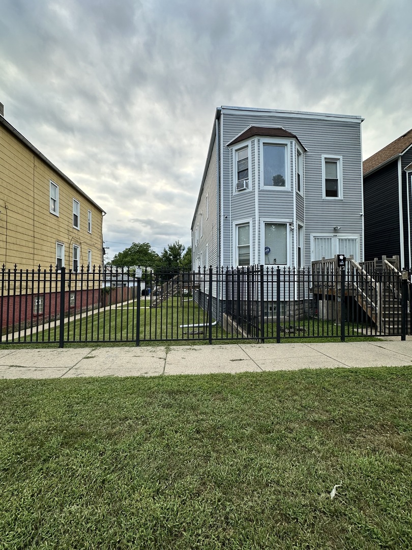 a view of a garden with a fence