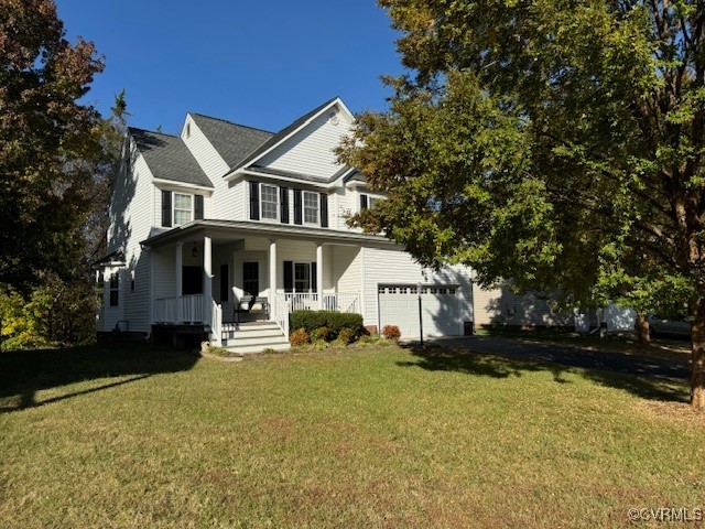 View of front of home with a porch, a front lawn,