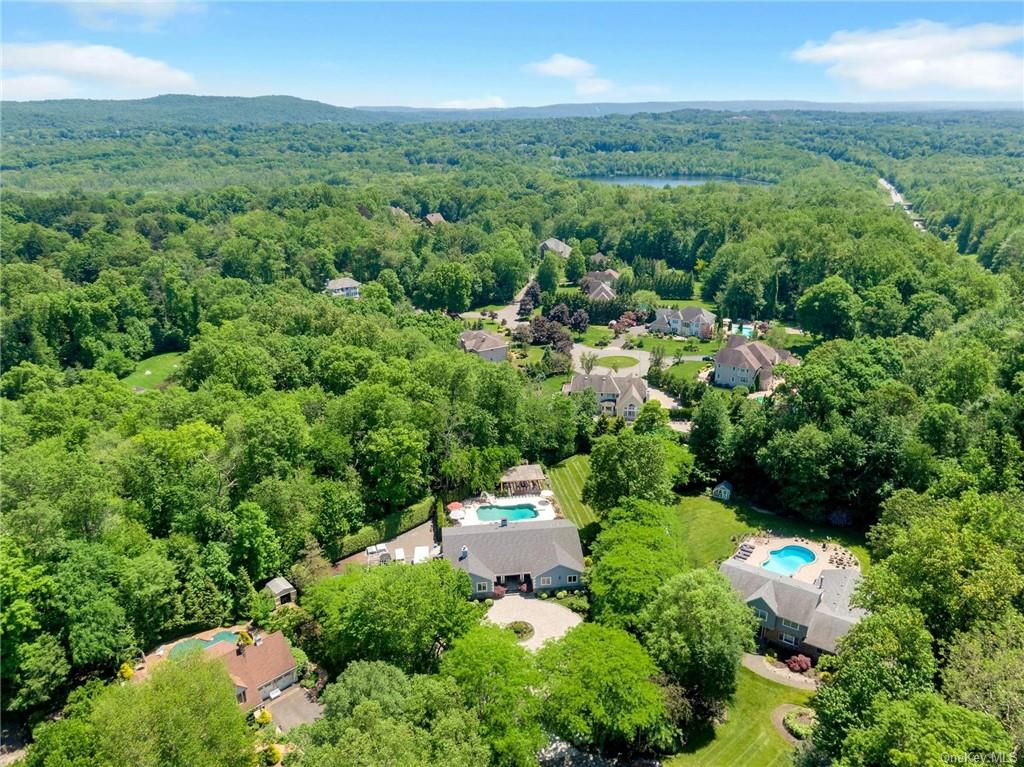 an aerial view of a house with mountain view