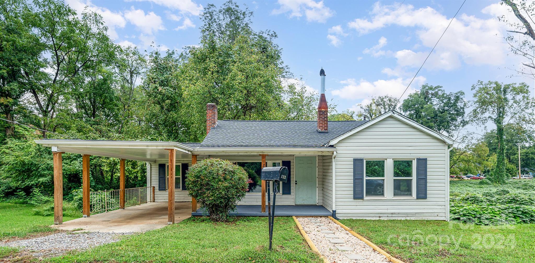 front view of a house with a yard