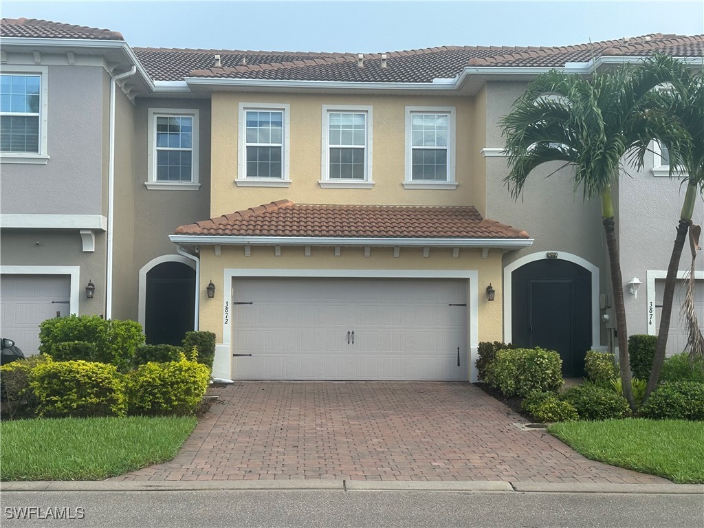 a front view of a house with a garage