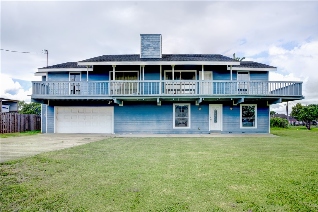 a view of front of house with a yard