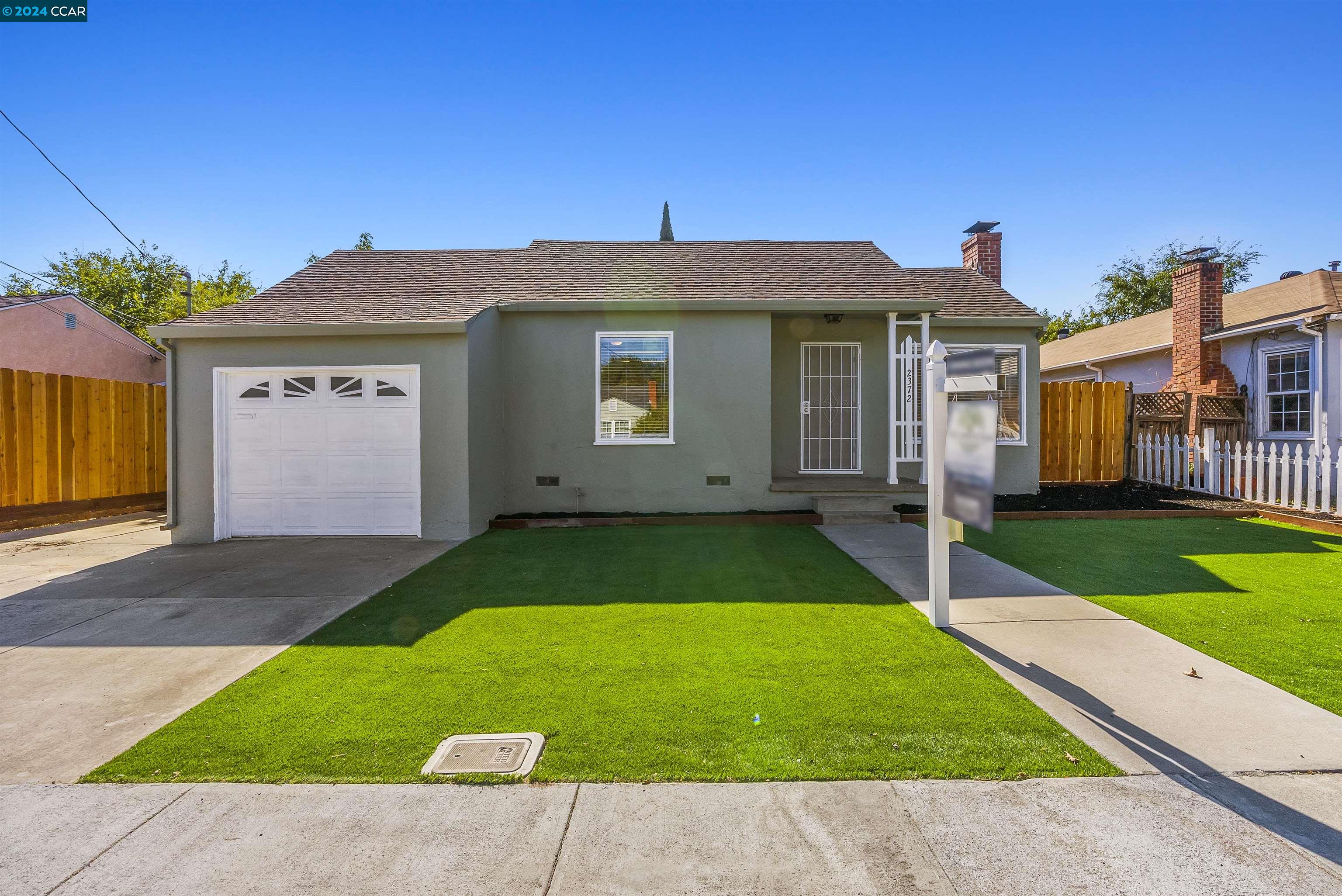 a front view of house with yard