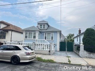 a front view of a house with parking