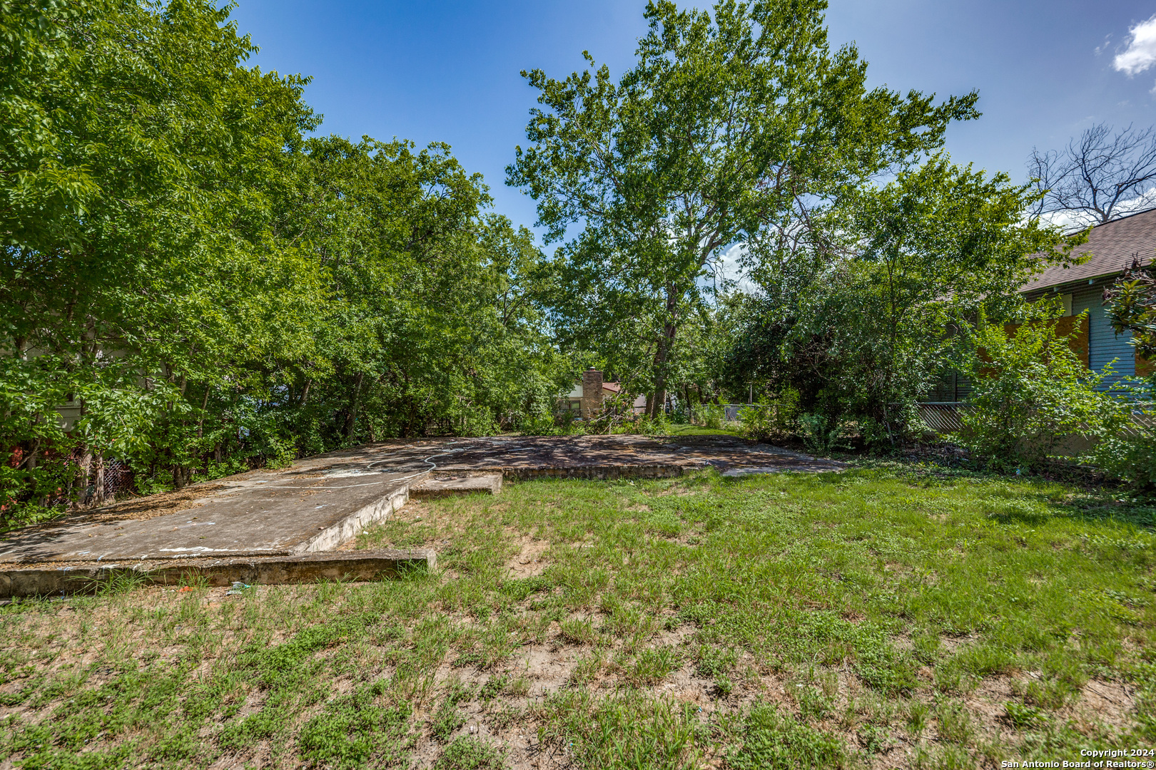 a view of a swimming pool with an outdoor space