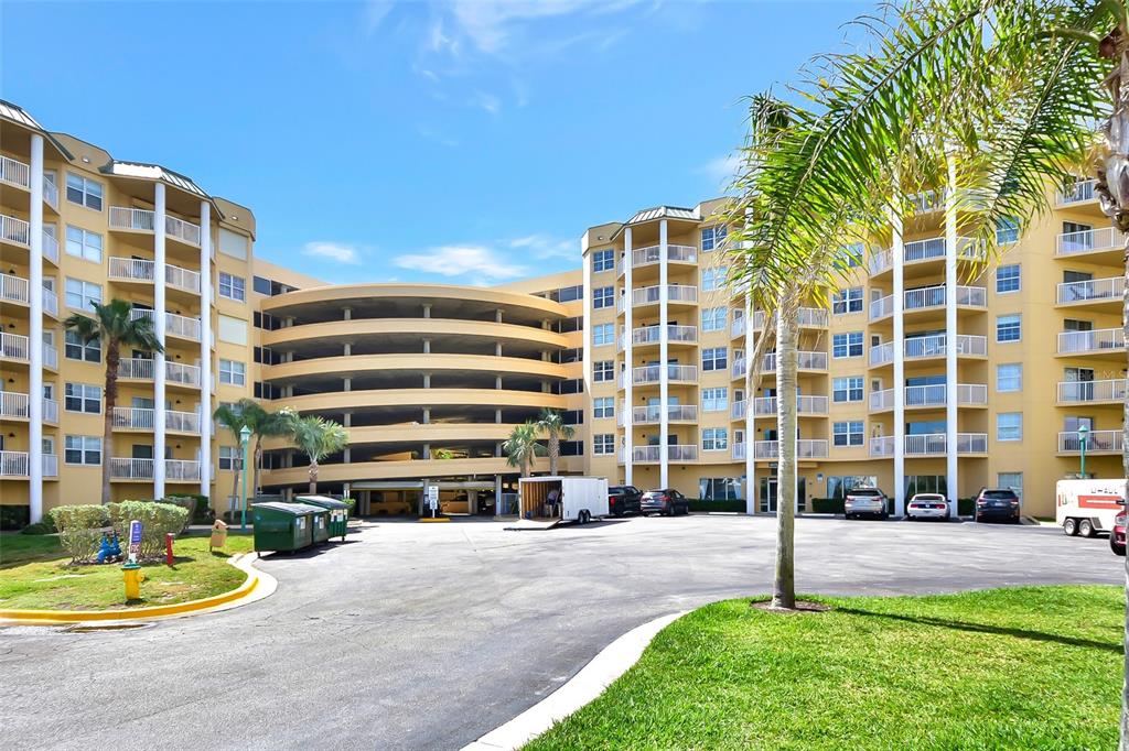 a front view of a building with a yard