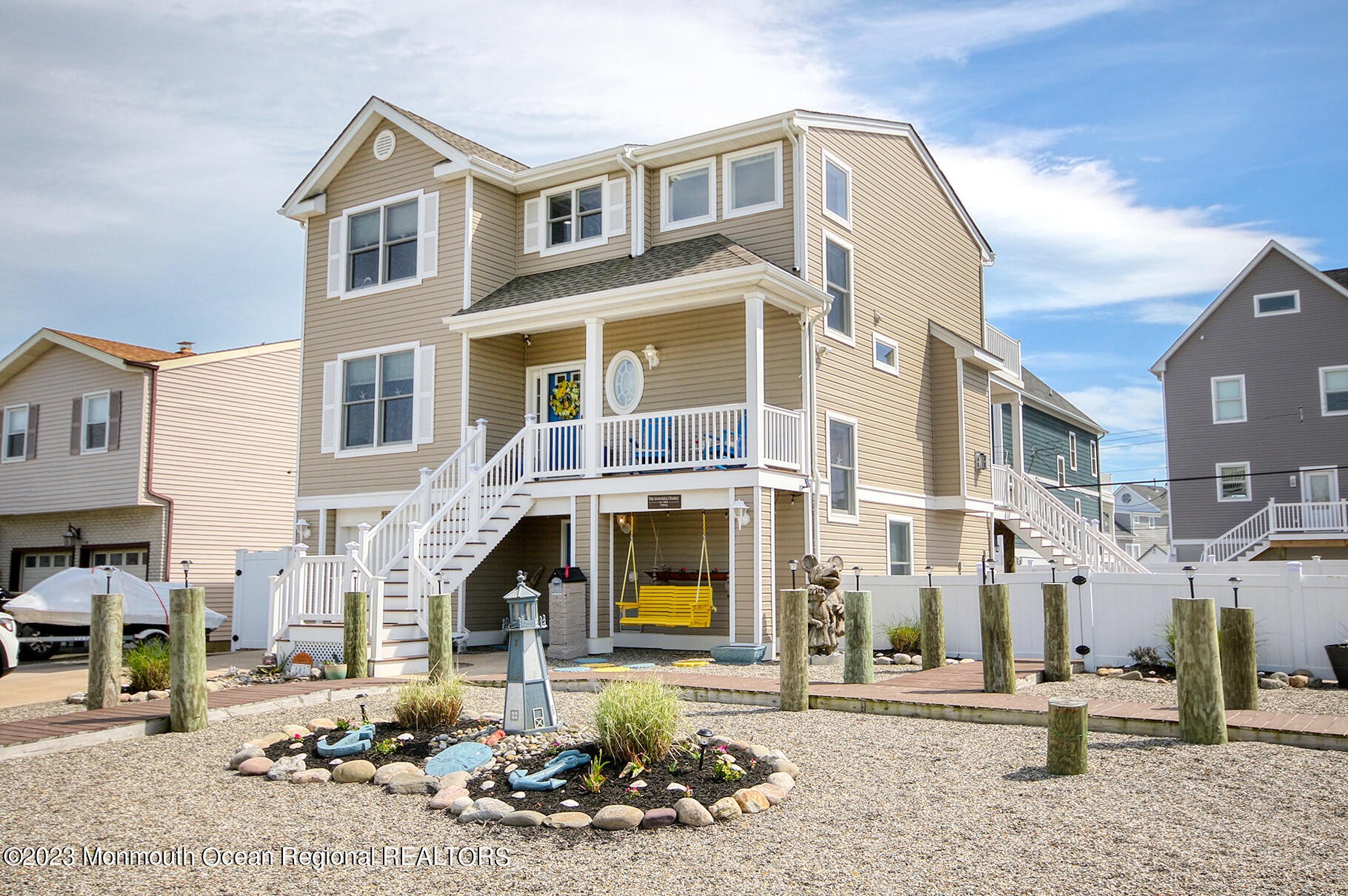 a front view of a residential apartment building with a yard