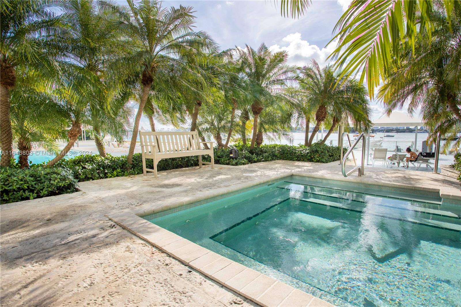 a view of yard with swimming pool and sitting area