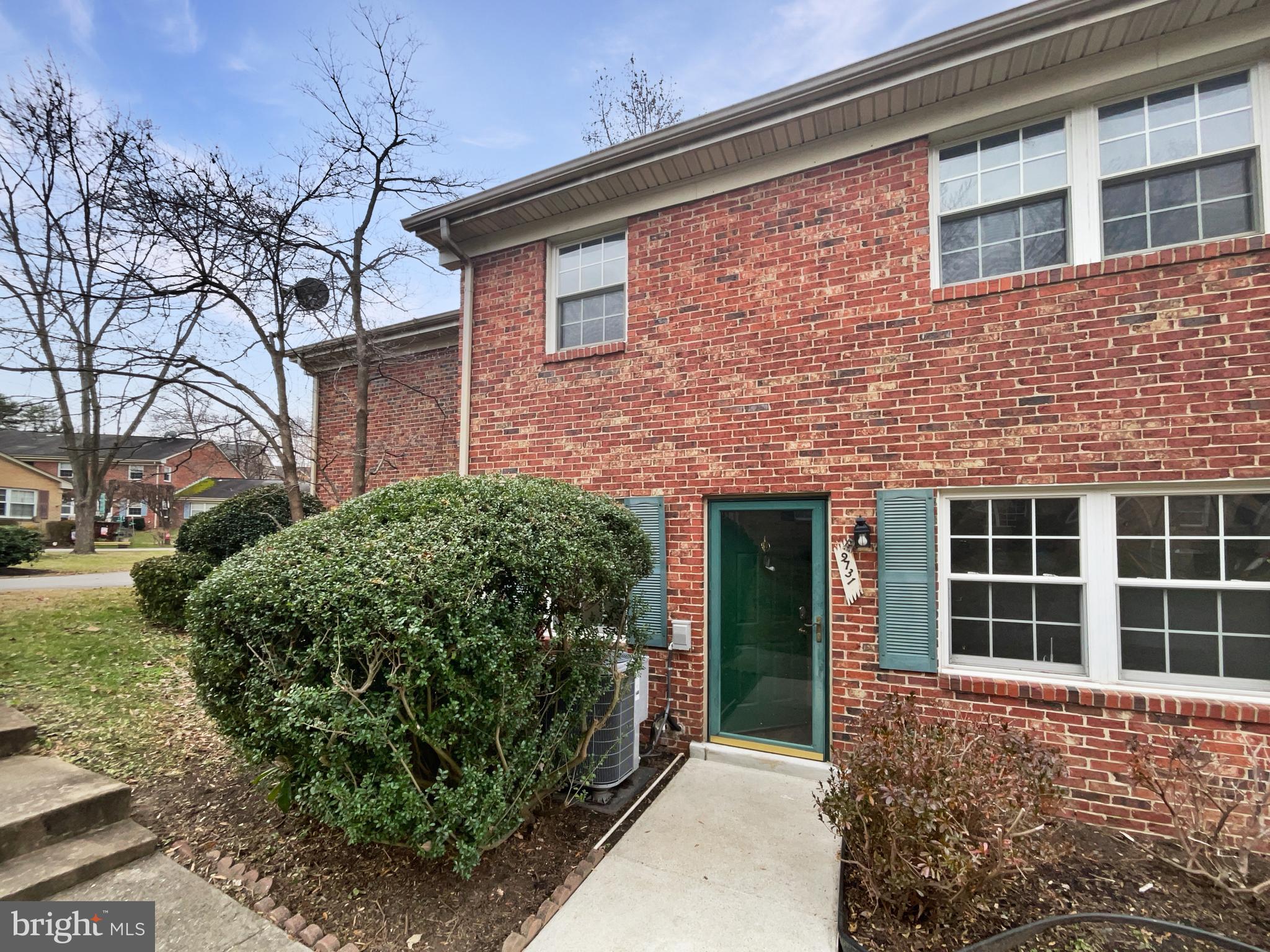 a view of a brick house with a large window