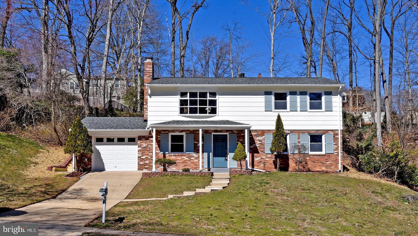 a view of a house with backyard porch and sitting area