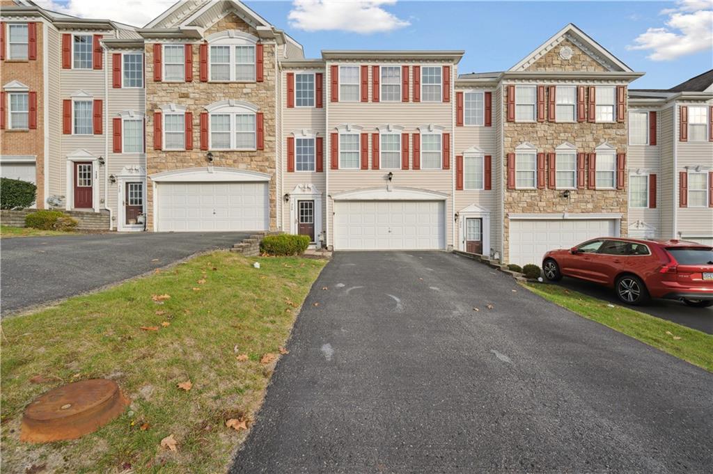 a view of multiple house with a yard