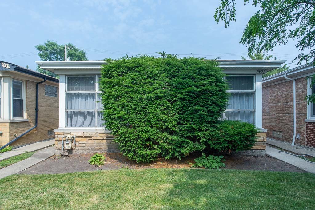 front view of a house with a yard