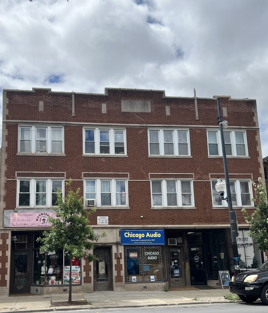 a front view of a building and a street